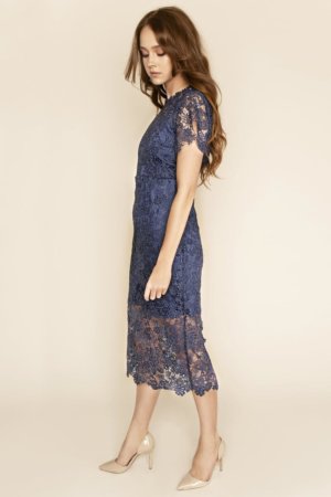 Hannah Guipure Lace Short Sleeved Midi Dress Look no further for the perfect occasion dress this season! Beautifully crafted in dark blue guipure lace that delicately hugs your figure, our Hannah midi dress will showcase your curves in the classiest of ways.