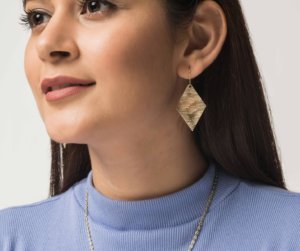 Heera Earrings. A pair of golden brass diamond shaped drop earrings with a rough textured effect. These earrings are made from waste metal used in other pieces of jewellery. An eco-friendly and contemporary product.