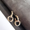 ENTWINED STEM WITH 2 CIRCLES EARRINGS