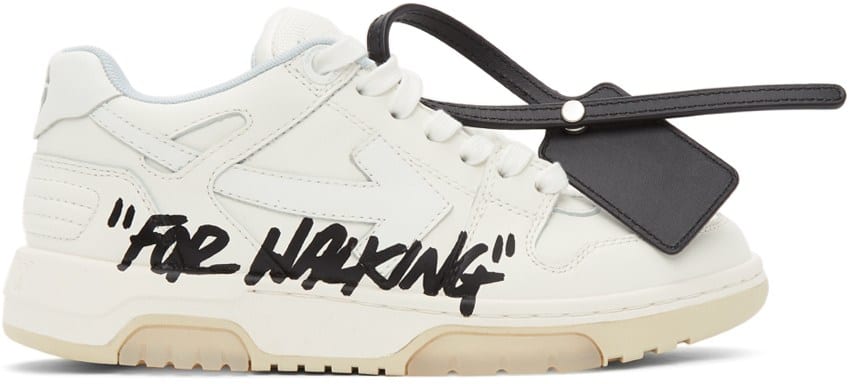 cream coloured sneakers with "FOR WALKING" branding
