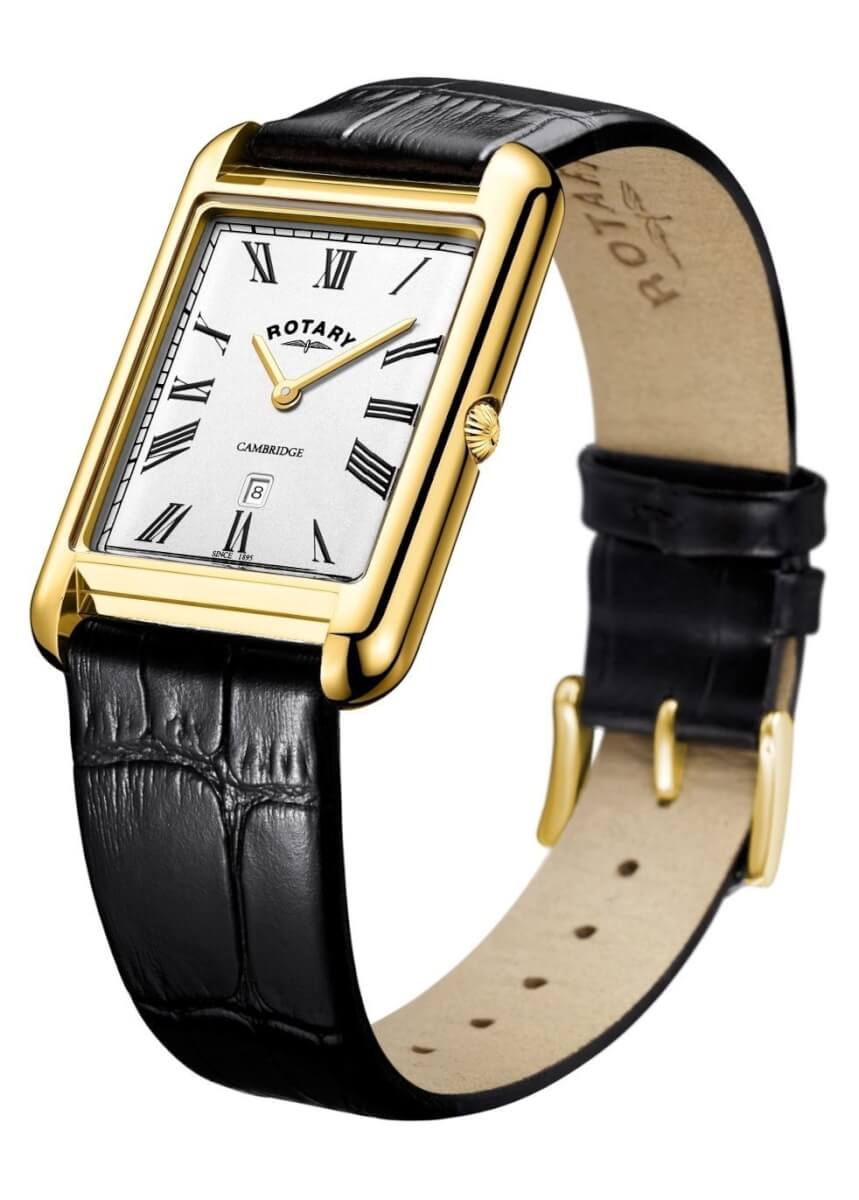 gold tone watch on black leather strap