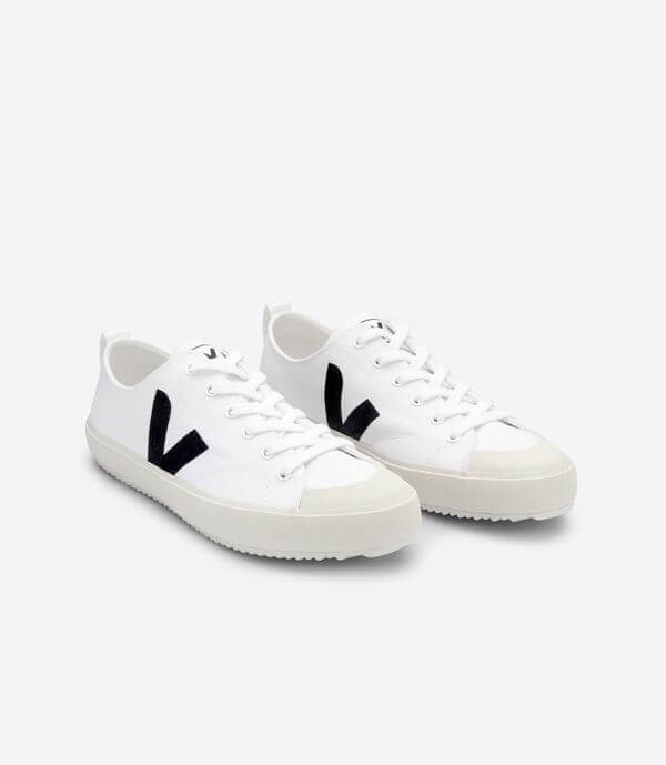 White low top canvas sneakers with black V logo