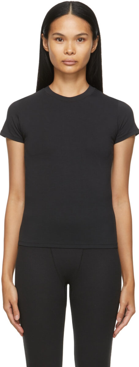 Short sleeve stretch cotton jersey T-shirt in black. Crewneck collar. Tonal textile logo patch at back collar.