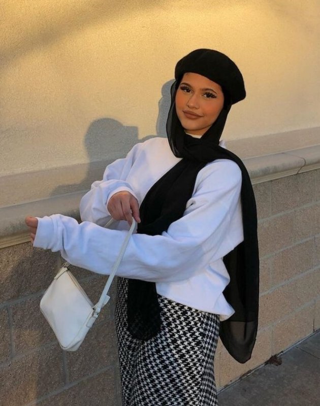 Hijabi wearing a chic monotone outfit completed with a black beret.