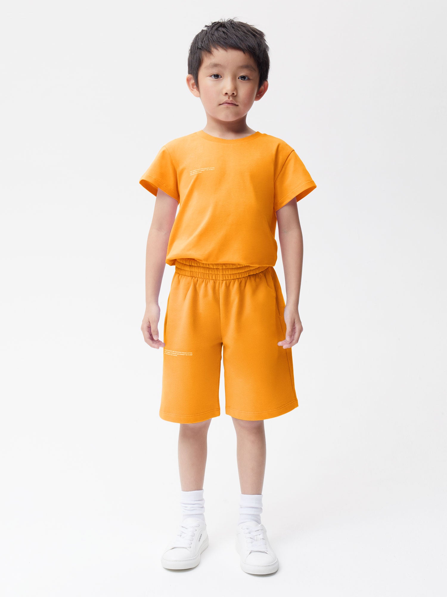 PANGAIA - Kids' Fruitful 365 Midweight Organic Cotton Long Shorts - tangerine orange 7-8YR